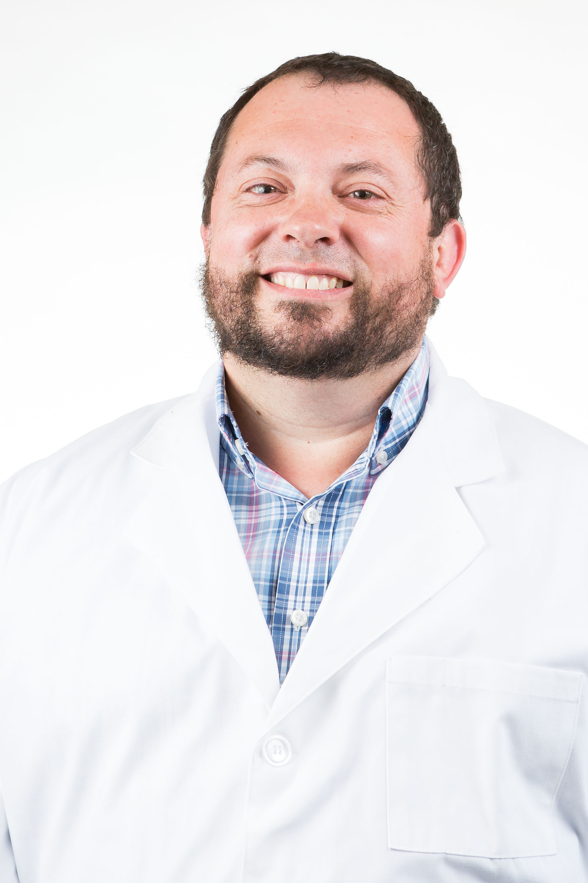 Dr. Don Bailey wearing white lab jacket