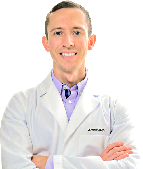 Orthodontist at Lane and Associates wearing white lab jacket smiling