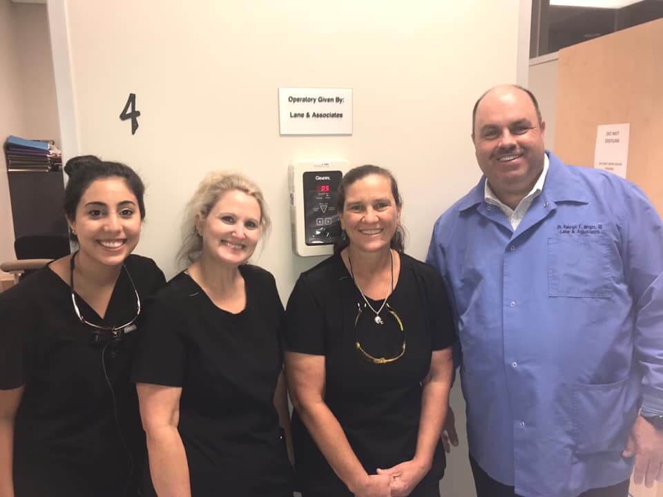 Volunteers smiling at Wake Smiles NC