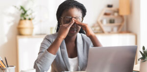 woman stressed sitting at desk