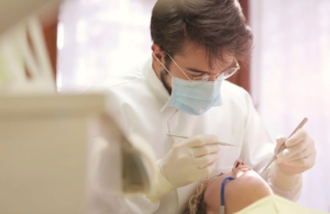 Dentist cleaning teeth