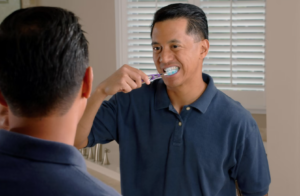guy brushing his teeth